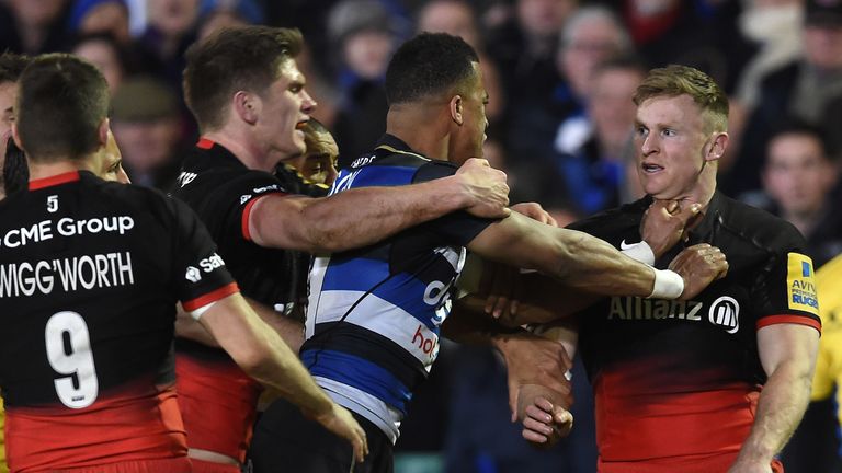 Tempers flare between Bath's Anthony Watson and Saracens' Chris Ashton (r)