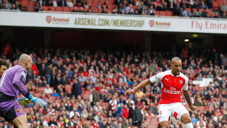 Theo Walcott turns home Arsenal's fourth in the 90th minute