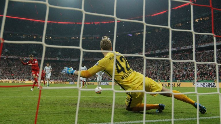 Thomas Mueller of Muenchen scores his teams second goal during the DFB Cup semi final match between FC Bayern Muenchen and Werder Bremen at Allianz Arena