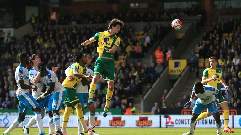 Timm Klose of Norwich City heads the ball to score
