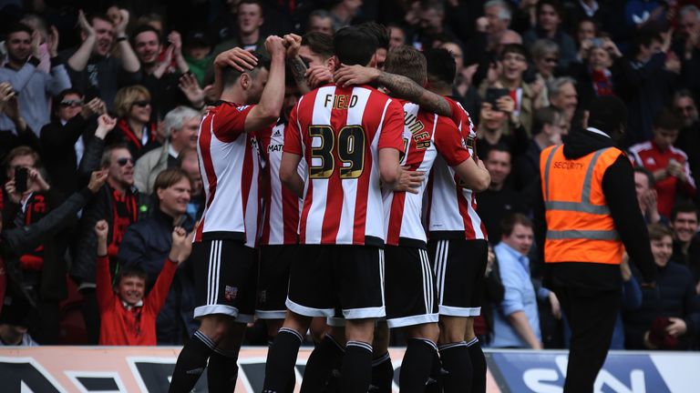 Tom Field celebrates with his Brentford team mates 