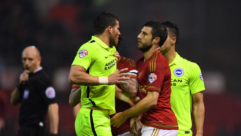 NOTTINGHAM, ENGLAND - APRIL 11:  Tomer Hemed of Brighton and Hove Albion and Bojan Jokic of Nottingham Forest confront each other during the Sky bet Champi