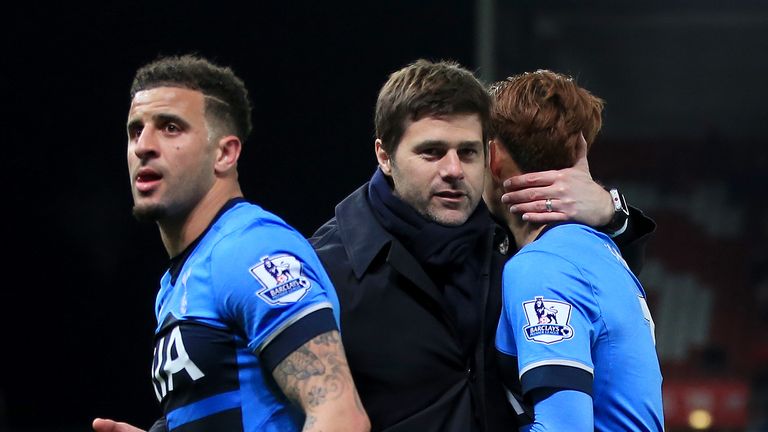 Tottenham Hotspur manager Mauricio Pochettino (centre) greets Son Heung-Min (right) and Kyle Walker after the final whistle at Stoke, Premier League