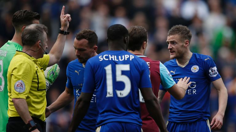Leicester Jamie Vardy (right) reacts after referee Jonathan Moss awarded him a second yellow card for simulation