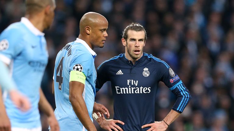 Manchester City's Vincent Kompany marks Real Madrid's Gareth Bale during the UEFA Champions League semi-final match at the Etihad Stadium