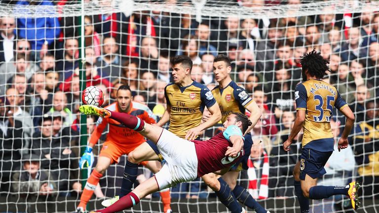 Andy Carroll of West Ham United scores his team's second goal during the Barclays Premier League match between West Ham and Arsenal