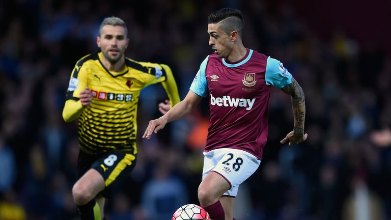 Manuel Lanzini is closed down by Valon Behrami