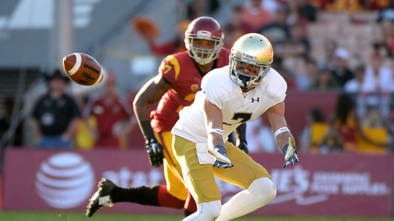 William Fuller #7 of the Notre Dame Fighting Irish prepares to catch a pass in front of Gerald Bowman #27 of the USC Trojan