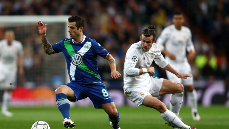 Vierinha of Wolfsburg evades Gareth Bale of Real Madrid during the UEFA Champions League quarter final second leg match between Real Madrid and Wolfsburg 