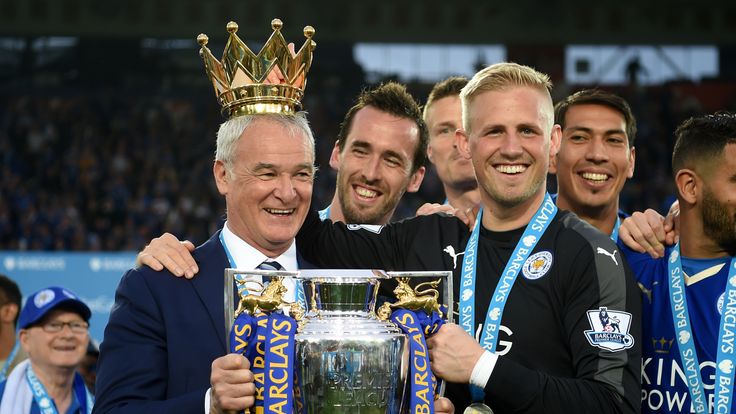 Claudio Ranieri poses with the Premier League Trophy