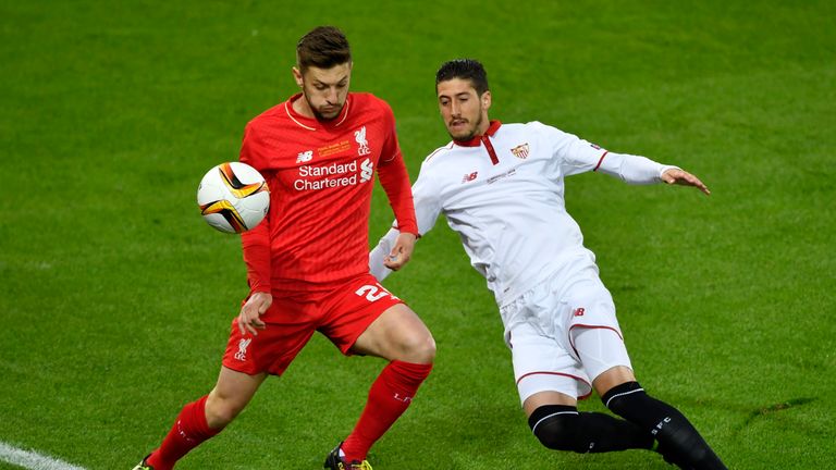 Liverpool's English midfielder Adam Lallana (L) vies for the ball with  Sevilla's Spanish defender Sergio Escudero  during the UEFA Europa League final foo