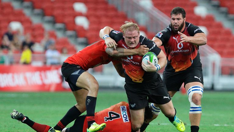 Bulls' Adriaan Strauss is tackled by Tusi Pisi of the Sunwolves in a Super Rugby match