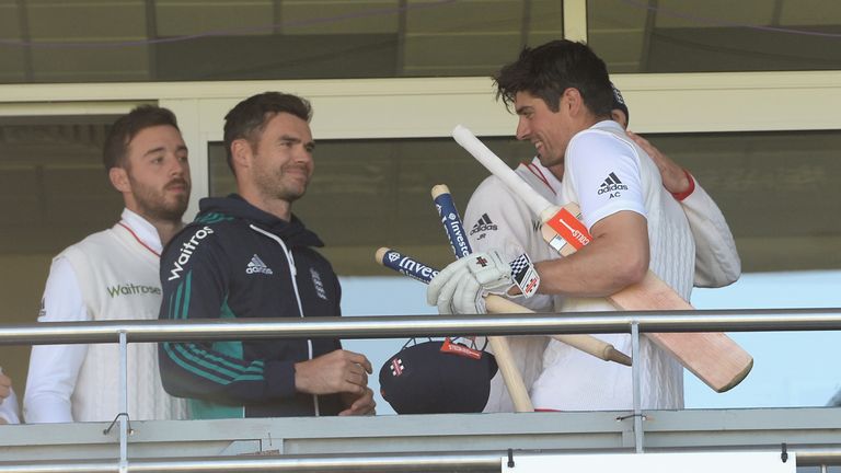 England captain Alastair Cook is congratuted by teammates James Anderson and Joe Root after reaching 10,000 Test runs