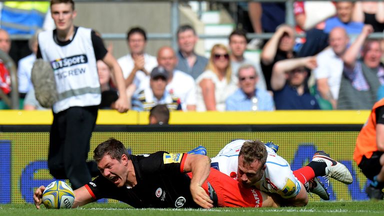 LONDON, ENGLAND - MAY 28:  Alex Goode of Saracens dives over the line to score his team's third try during the Aviva Premiership final match between Sarace