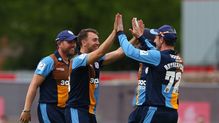 MANCHESTER, ENGLAND - MAY 21:  Alex Hughes of Derbyshire celebrates with Hamish Rutherford after taking the wicket of Alviro Petersen of Lancashire during 