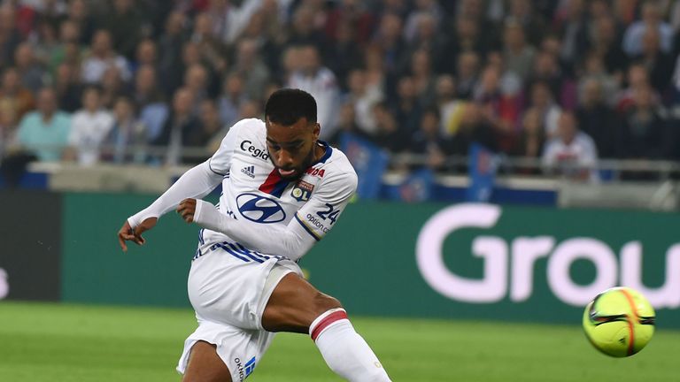 Lyon's French forward Alexandre Lacazette shoots the ball during the French L1 football match Olympique Lyonnais and AS Monaco on May 7, 2016, at the New S