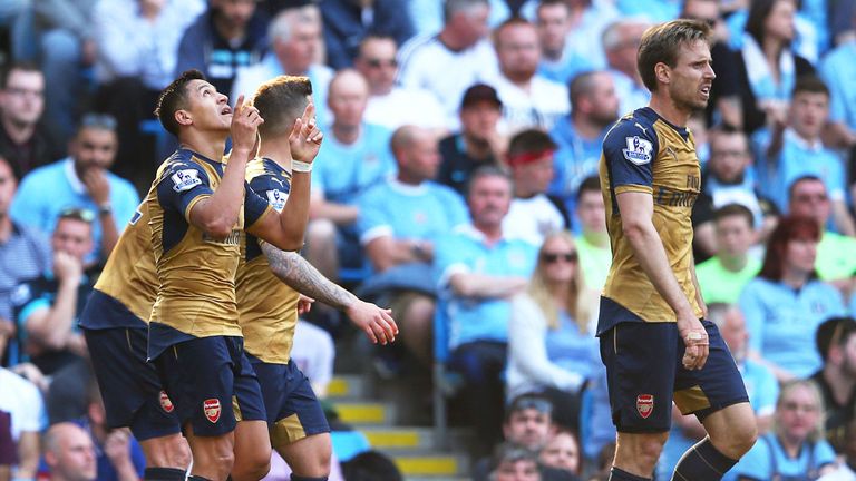 Alexis Sanchez points to the sky after scoring for Arsenal at Manchester City