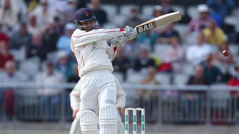 Alviro Petersen of Lancashire plays a shot for four to bring up his century during the Specsavers County Championship