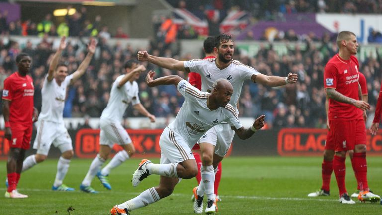 Andre Ayew of Swansea City celebrates scoring the opening goal
