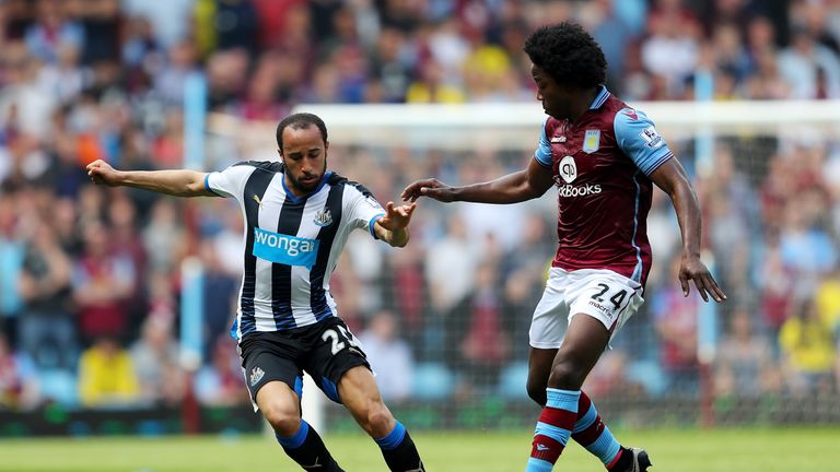 Andros Townsend of Newcastle United goes on a run under the watchful eye of Carlos Sanchez