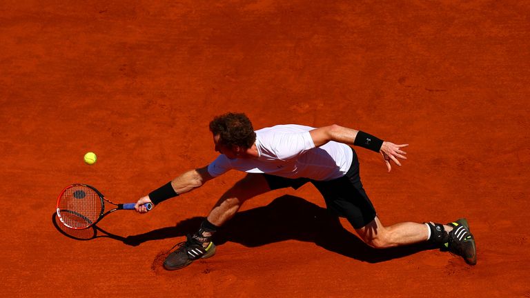 Andy Murray of Great Britain stretches for a backhand in his Men's Semi Final match against Novak Djokovic