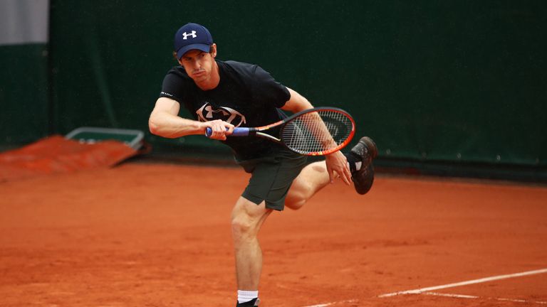 Andy Murray warms up for his first round match against Radek Stepanek