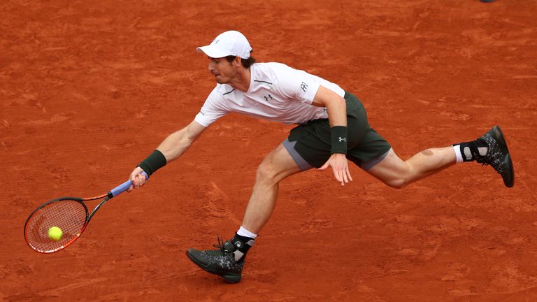 Murray retrieves another big forehand from John Isner