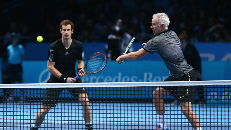 Andy Murray of Great Britain and John McEnroe of USA in action in the exhibition match against Tim Henman of England and Pa