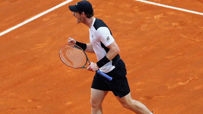 Andy Murray celebrates winning the first set against Novak Djokovic in Rome on Sunday