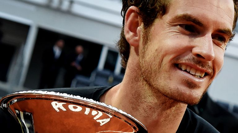 England's Andy Murray poses with his trophy after winning the men's final match against Serbia's Novak Djokovic at the ATP Tennis Open on May 15, 2016 at t