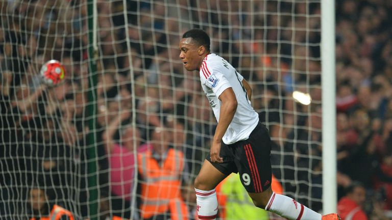 Manchester United's French striker Anthony Martial celebrates after scoring their first goal during the English Premier League football match between West 