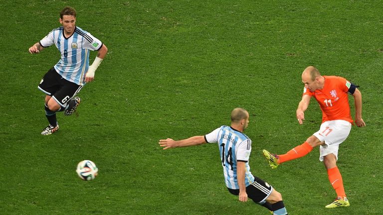 Arjen Robben takes on Javier Mascherano and Lucas Biglia during the semi-final of the 2014 World Cup