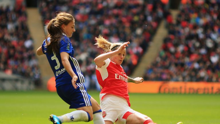 LONDON, UNITED KINGDOM - MAY 14:  Kelly Smith of Arsenal stretches to tackle Hannah Blundell of Chelsea during the SSE Women's FA Cup Final between Arsenal