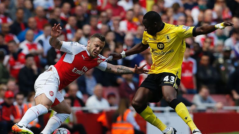 Arsenal's English midfielder Jack Wilshere (L) vies with Aston Villa's French defender Aly Cissokho during the English Premier League football match betwee
