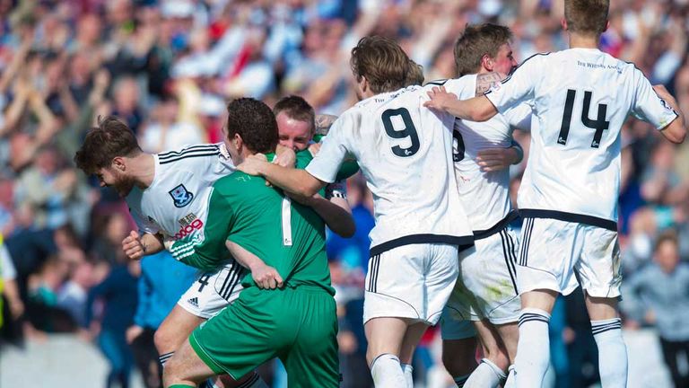 Ayr United goalkeeper Greg Fleming is mobbed after his penalty shoot-out heroics
