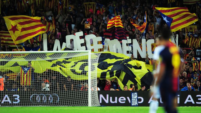 Barcelona's football fans hold letters forming the word "Independencia" and wave "Estelada", the Catalan independentist flag, during the Spanish League Cla