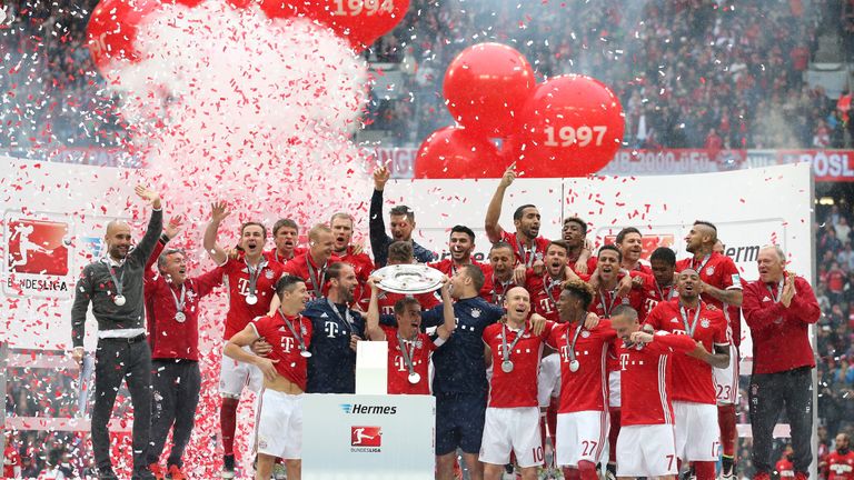 Bayer lift the 2015/16 Bundesliga trophy.