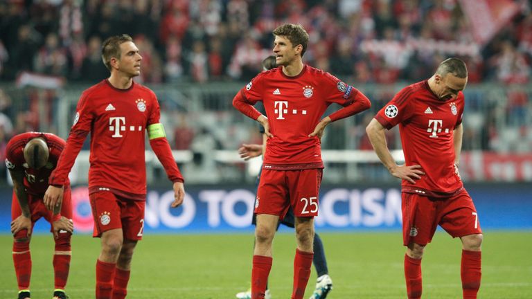 Philipp Lahm and Thomas Muller and Franck Ribery look dejected after the Champions League semi final match between Bayern Munich and Atletico Madrid