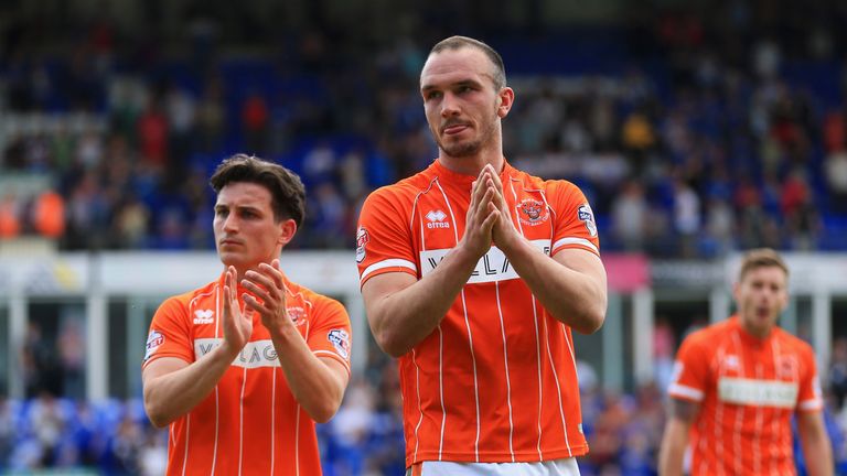 Tom Aldred and Jack Redshaw (left) of Blackpool looks dejected as they are relegated