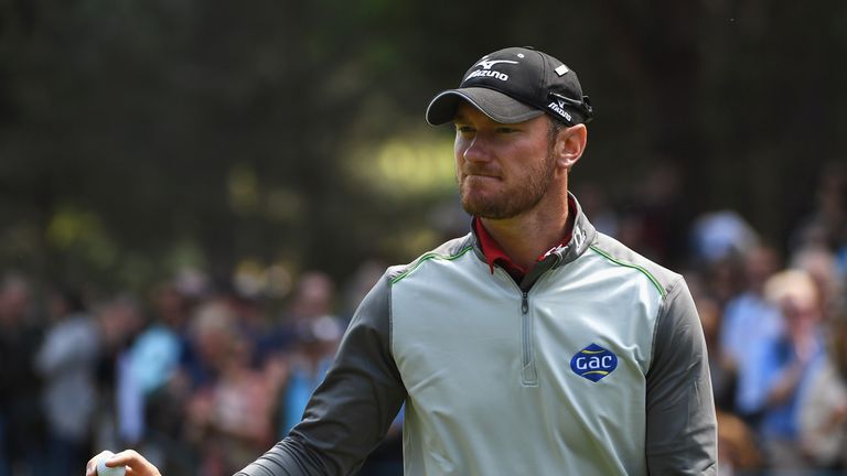 Chris Wood of England acknowledges his birdie on the 11th hole during day four of the BMW PGA Championship at Wentworth 