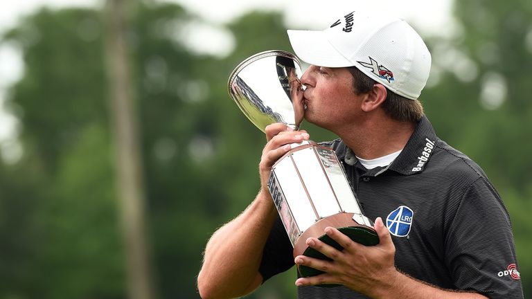 AVONDALE, LA - MAY 02:  Brian Stuard celebrates with the trophy following a two hole playoff to win the Zurich 