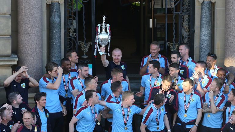 Burnley manager Sean Dyche lifts the Sky Bet Championship trophy during the civic reception at the Town Hall in Burnley.