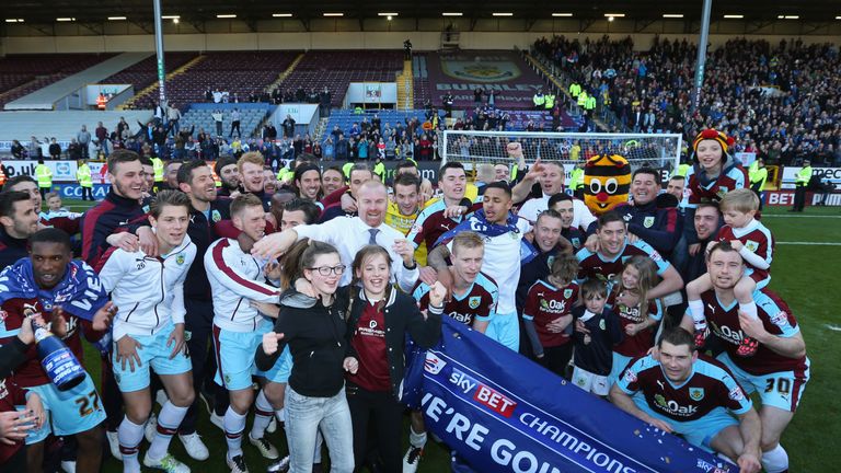 Burnley players and staff celebrate as they are promoted to the Premier League