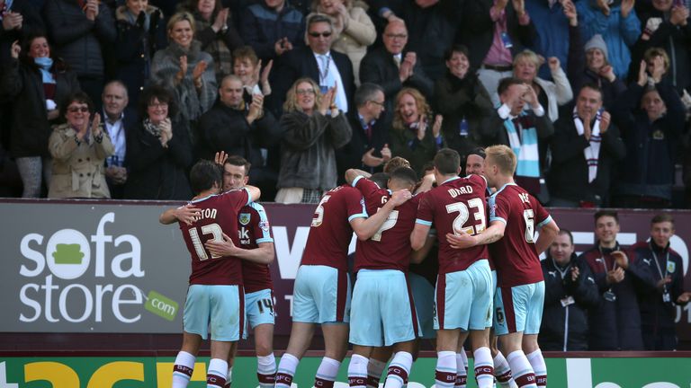 Burnley's Sam Vokes (obscured) celebrates scoring his side's first goal of the game with teammates