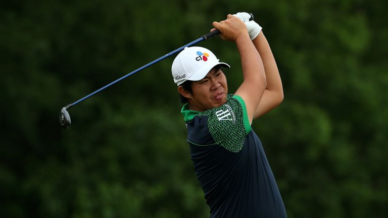 Byeong-Hun An of Korea hits his tee shot on the 8th hole during a continuation of the third round of the Zurich Classic at TPC Louisiana