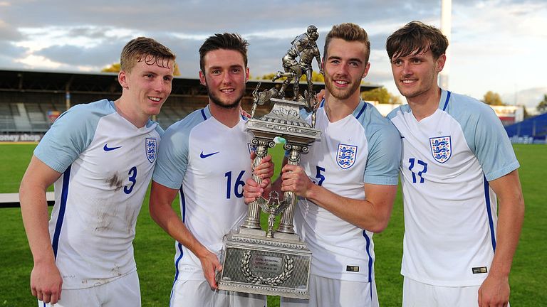 MattTargett, Matt Grimes, Calum Chambers and John Swift of England pose with the trophy