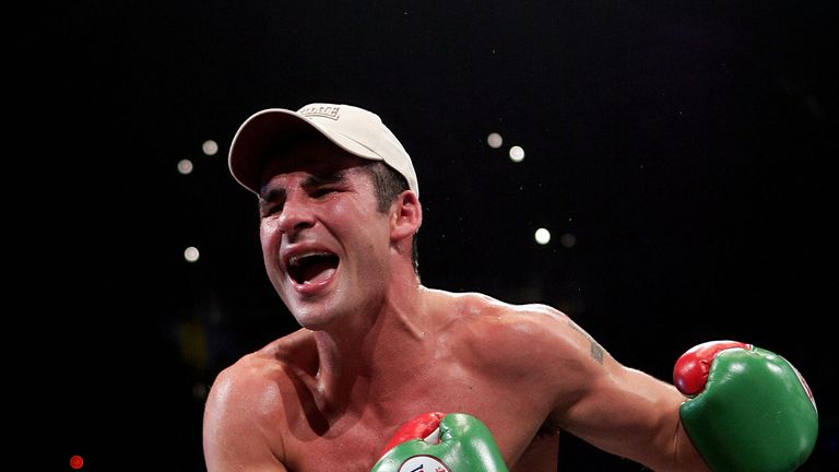 Joe Calzaghe celebrates after being declared winner of the super-middleweight title unification fight against Mikkel Kessler