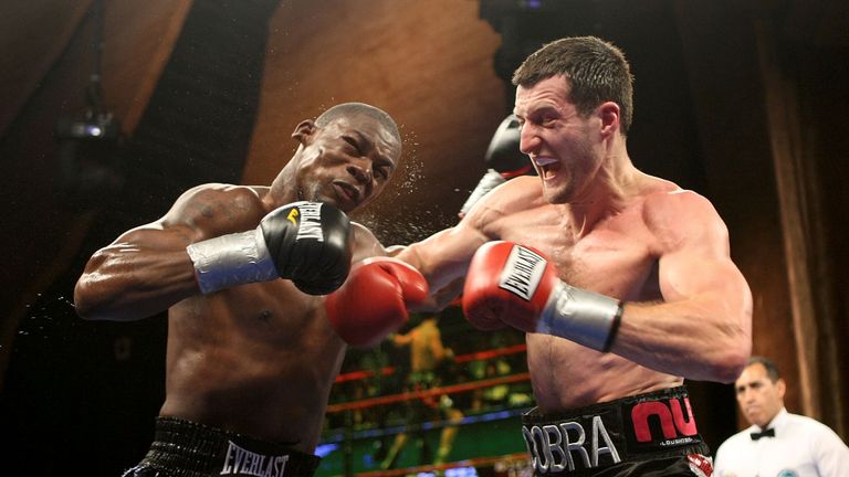 Carl Froch lands a right on Jermain Taylor during their WBC Super Middleweight Championship bout at the MGM Grand at Foxwoods