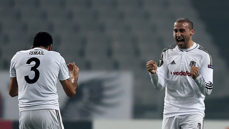 Besiktas' Turkish forward Cenk Tosun (R) 