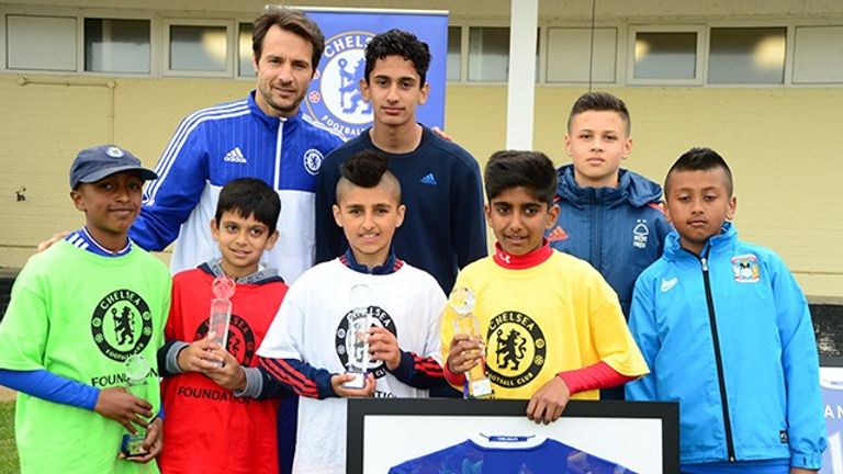 Carlo Cudicini poses with Asian Star winners past and present at Cobham